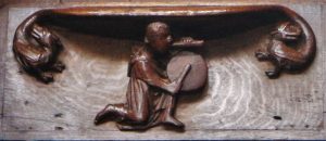 Misericord: Exeter Cathedral (14th Century( In that open field If you do not come too close, if you do not come too close, On a summer midnight, you can hear the music Of the weak pipe and the little drum